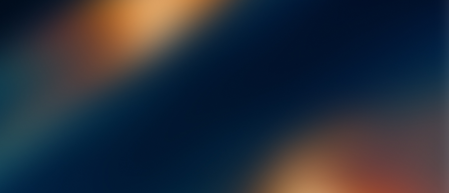 Abstract blurred gradient with dark blue background and soft orange and brown highlights.