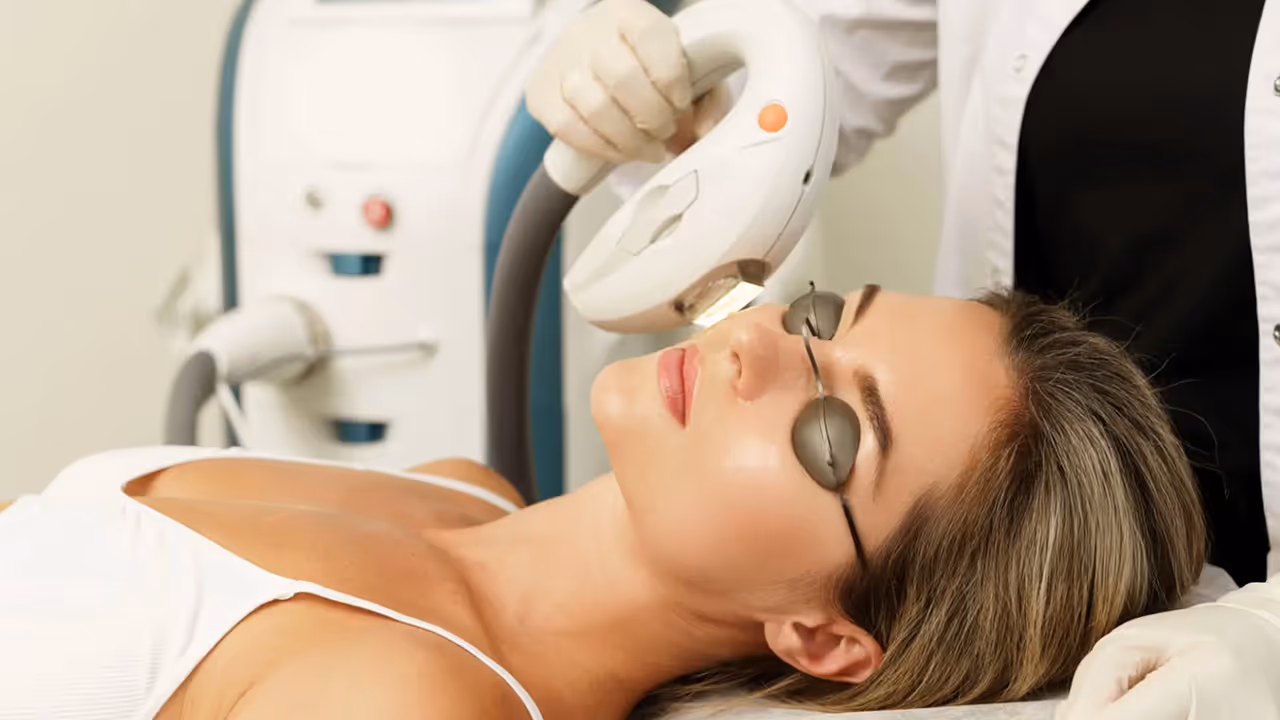 Client receiving IPL photofacial treatment to reduce sun damage.