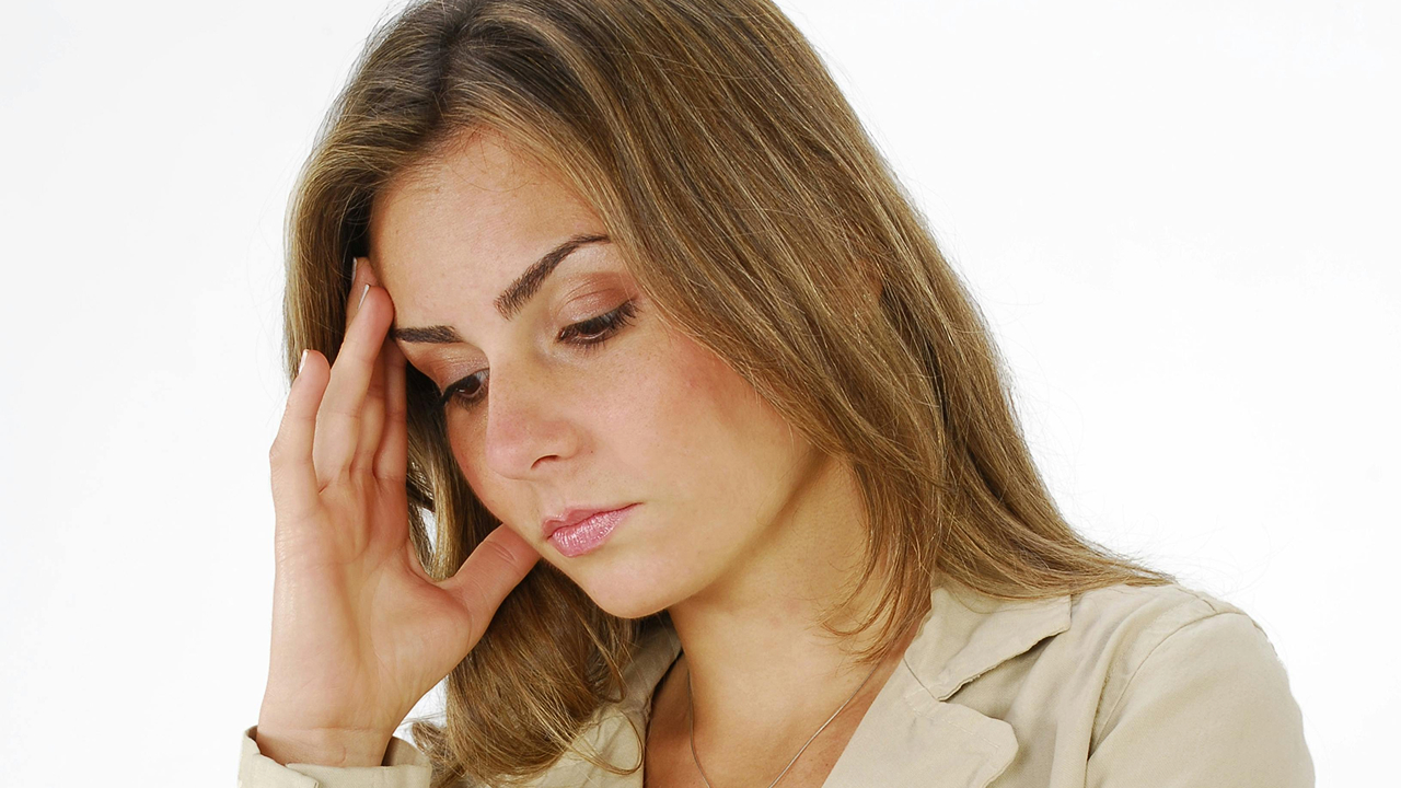 Woman receiving Botox injection on forehead to smooth fine lines and reduce wrinkles.