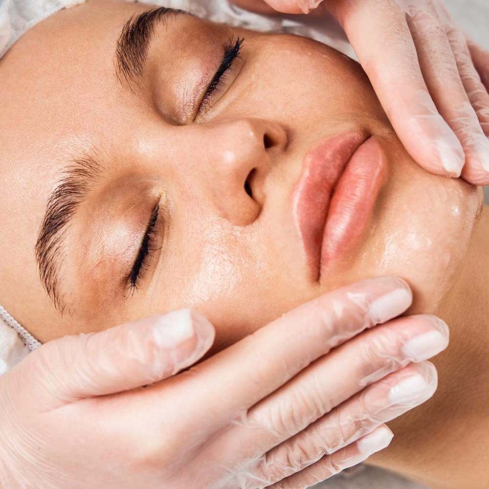 Woman receiving a professional facial skincare treatment.