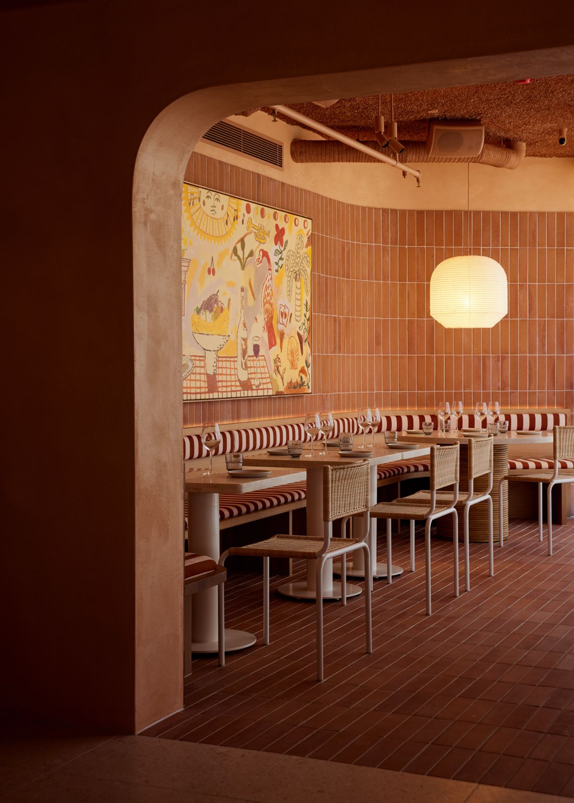 Terracotta tiles in a dining area wall cladded and tiled