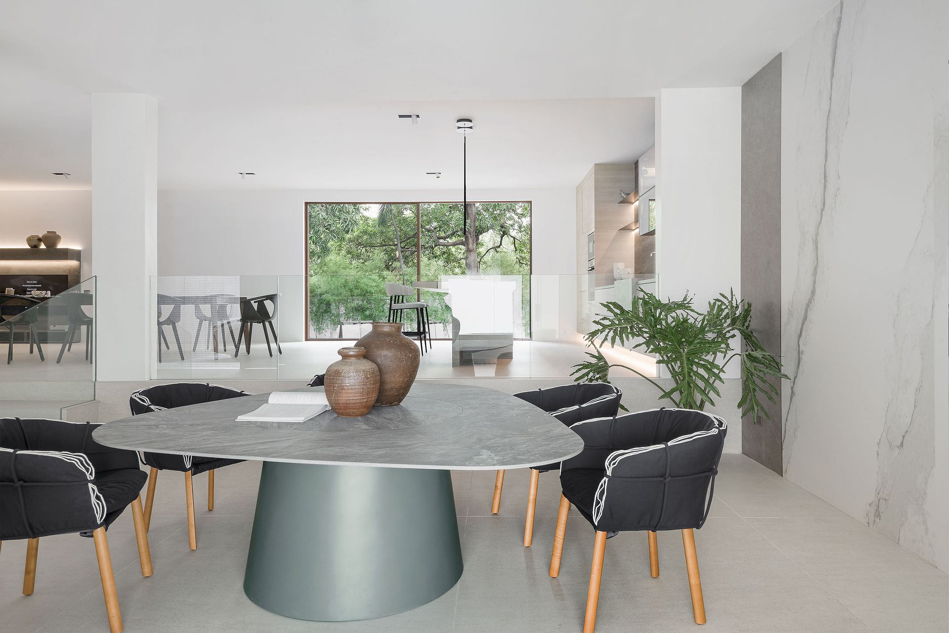A modern minimalist interior of the Mobler Flagship showroom in san juan city philippines made with engineered stone that exudes clean lines and modern luxurious look