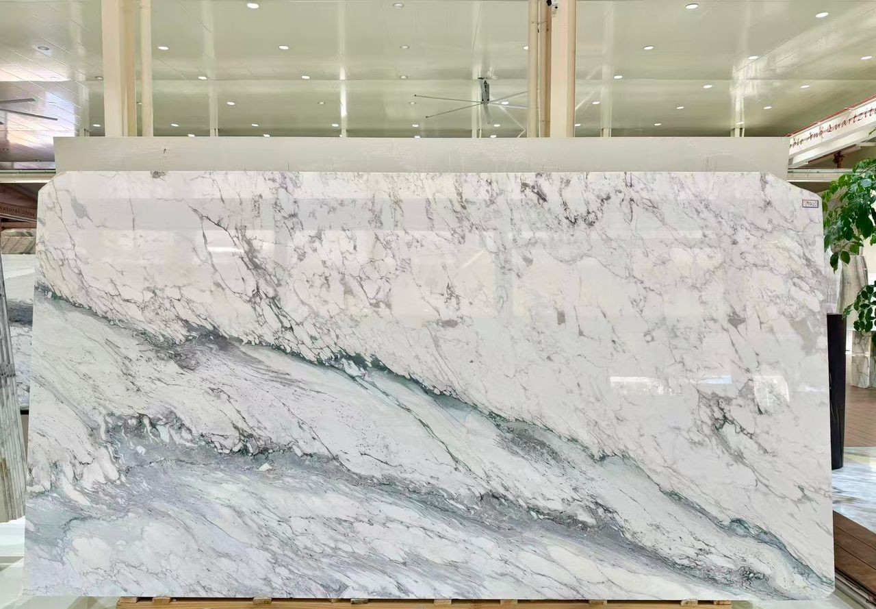Calacatta Monet full slab with unique green veining flowing through its white background