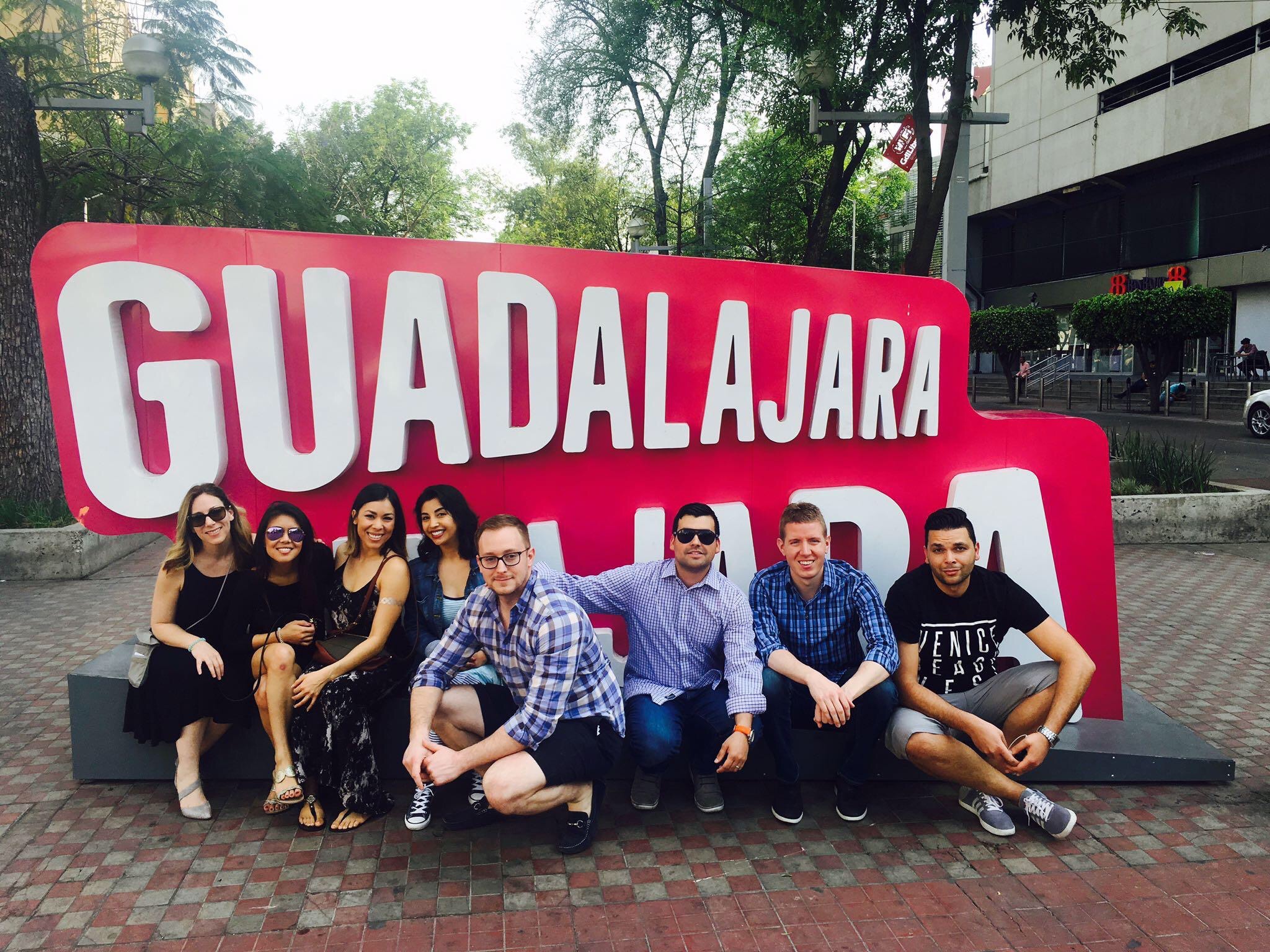 Cydcor's volunteer medical mission team in front of a sign in Guadalajara.