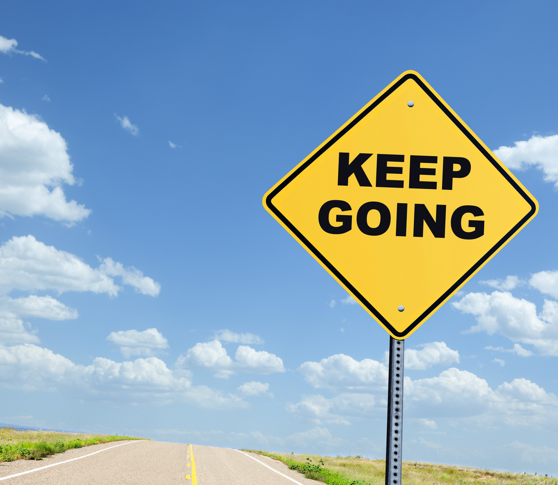 A road sign warning that says "Keep Going".