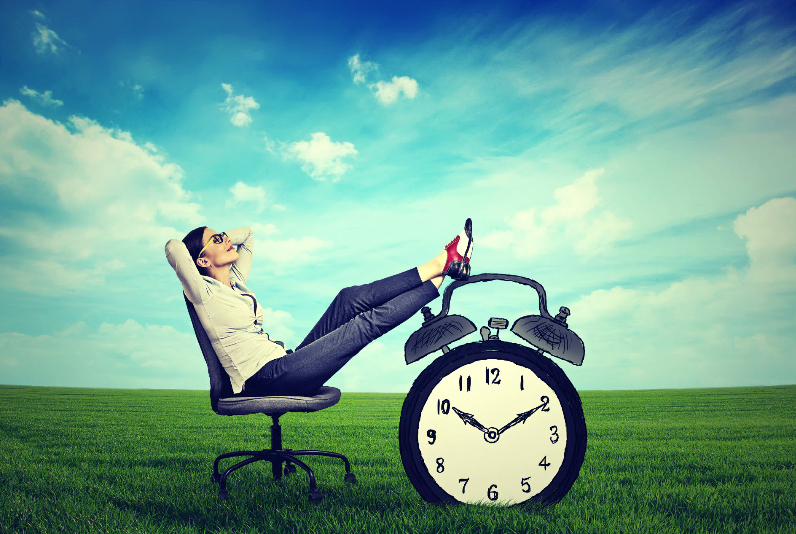 Woman with legs on desk at work
