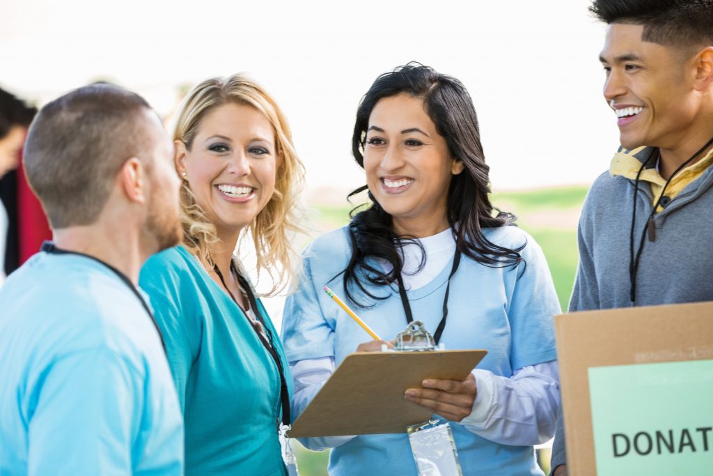 Volunteers working together at a food drive.