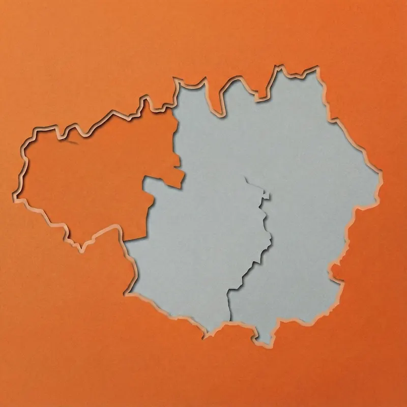 Cutout of a map with three adjacent regions outlined on an orange background, showing distinct borders and shapes.