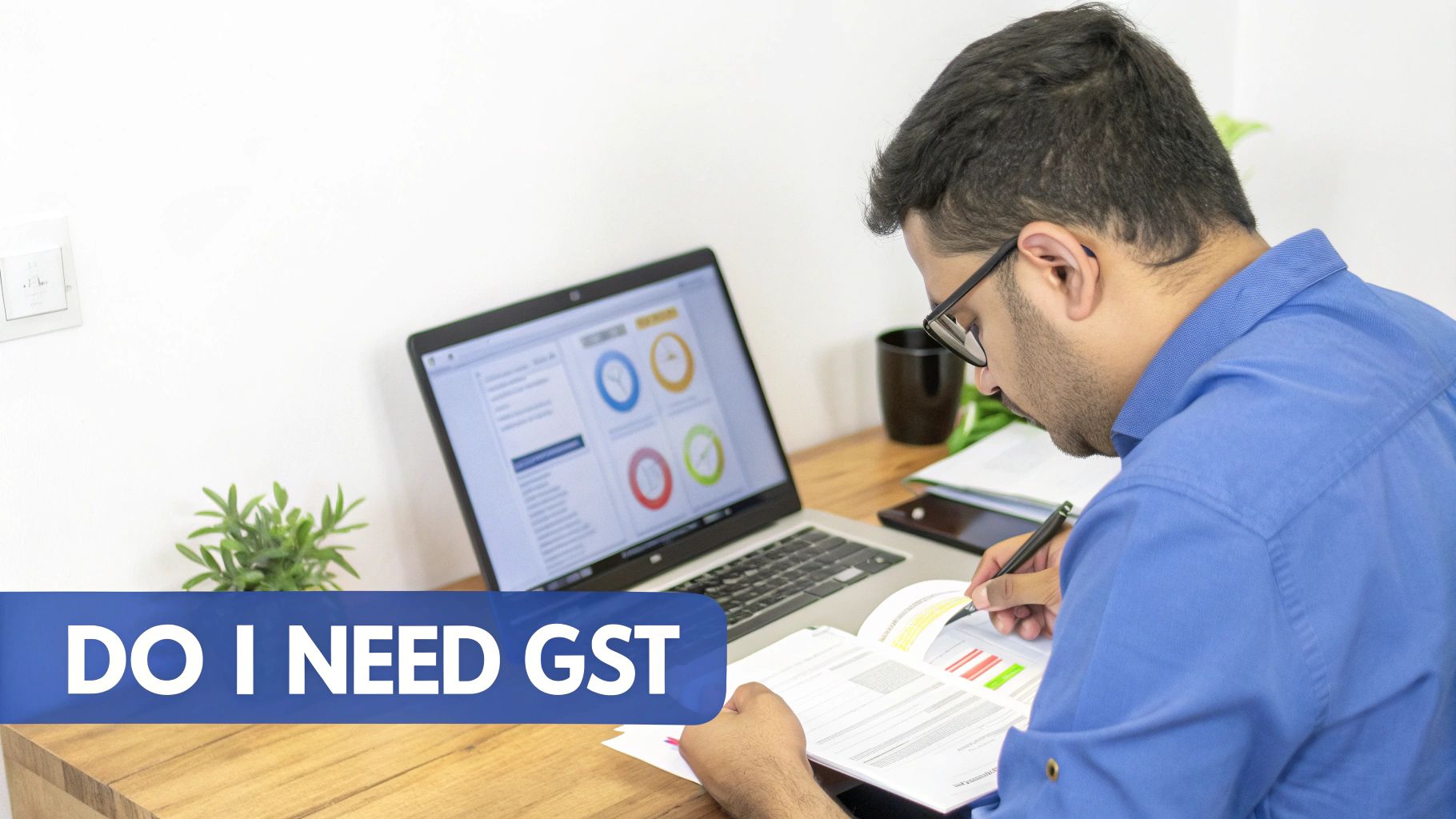 An individual consults documents and a laptop with data, contemplating the need for GST registration.