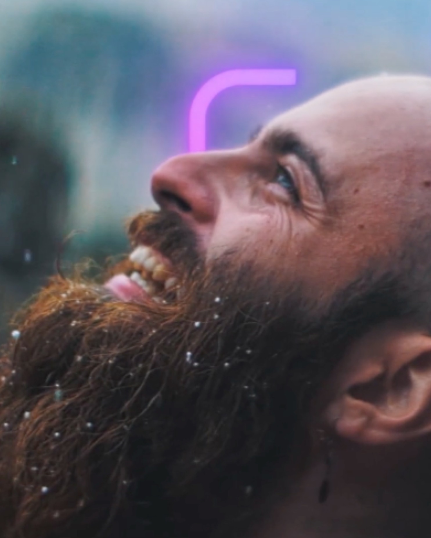 Hands holding a tablet displaying a smiling woman's face with a purple facial recognition frame.