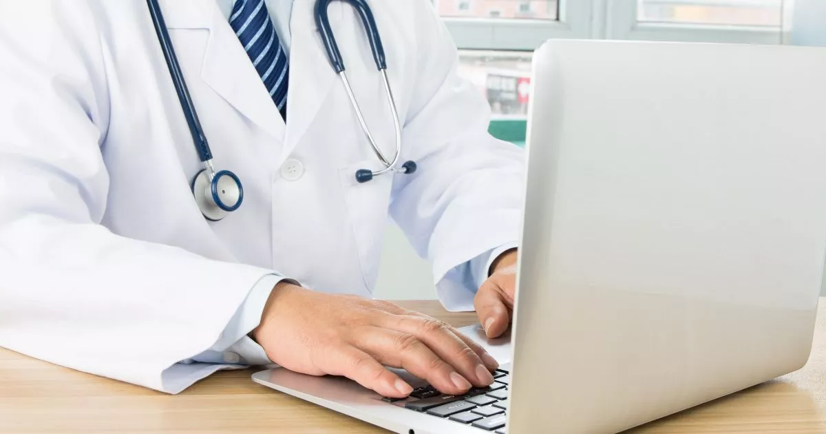 Grayscale image of a robotic arm in a clean, modern environment.