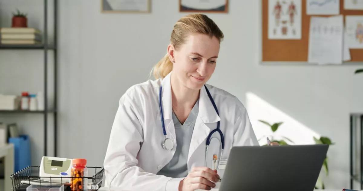 Grayscale image of a robotic arm in a clean, modern environment.