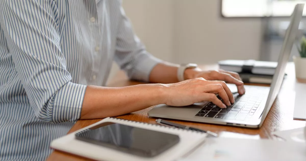 Grayscale image of a robotic arm in a clean, modern environment.