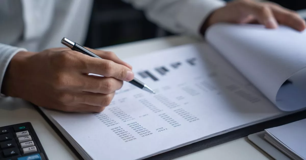 Grayscale image of a robotic arm in a clean, modern environment.