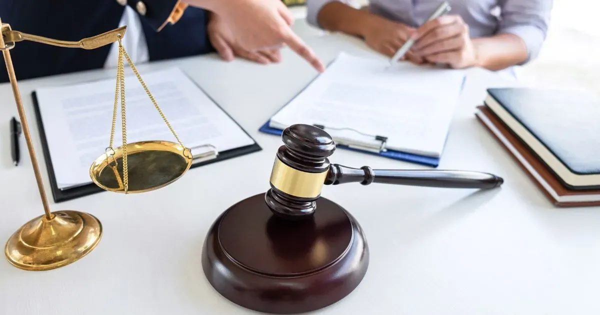 Grayscale image of a robotic arm in a clean, modern environment.