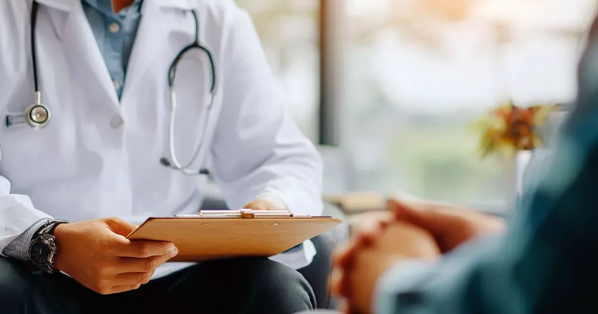 Grayscale image of a robotic arm in a clean, modern environment.