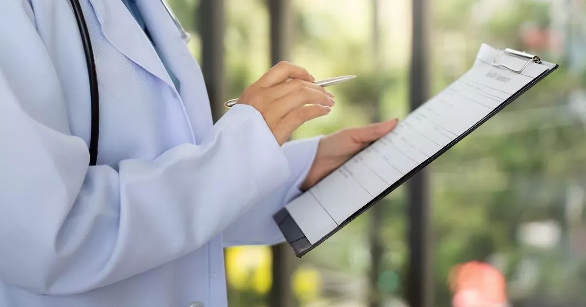 Grayscale image of a robotic arm in a clean, modern environment.