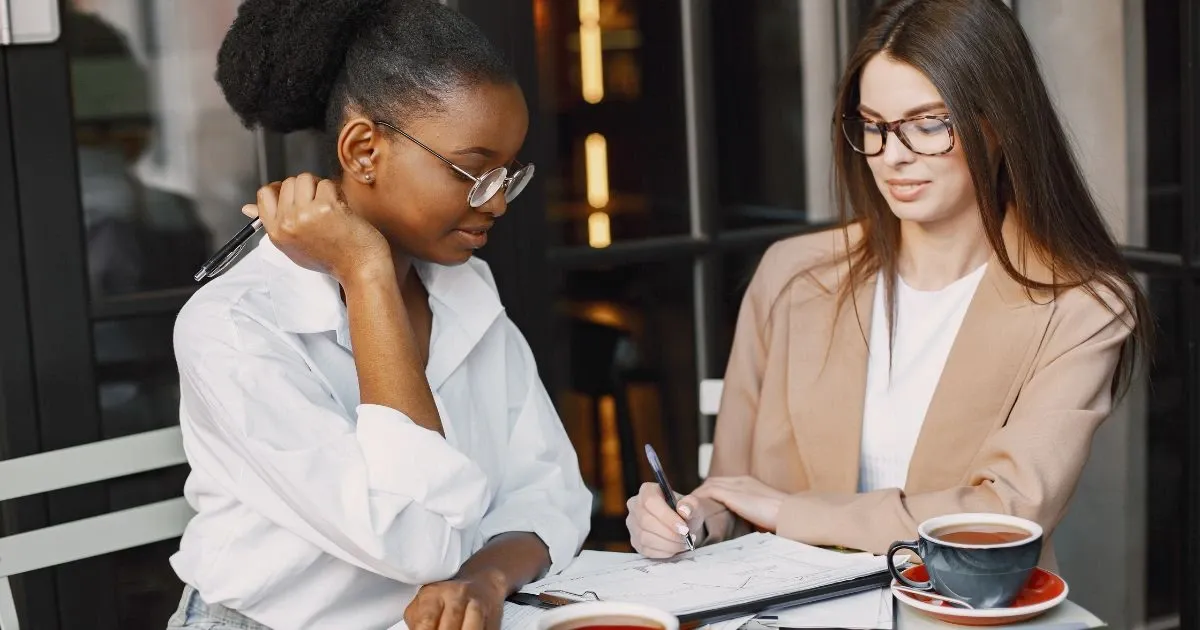 Grayscale image of a robotic arm in a clean, modern environment.