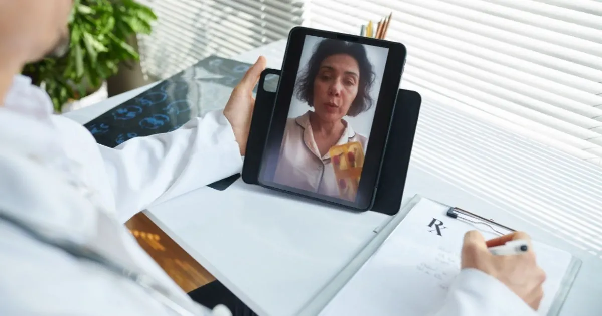 Grayscale image of a robotic arm in a clean, modern environment.