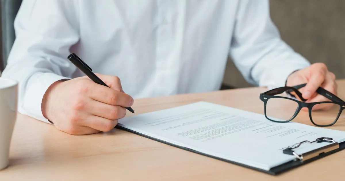 Grayscale image of a robotic arm in a clean, modern environment.