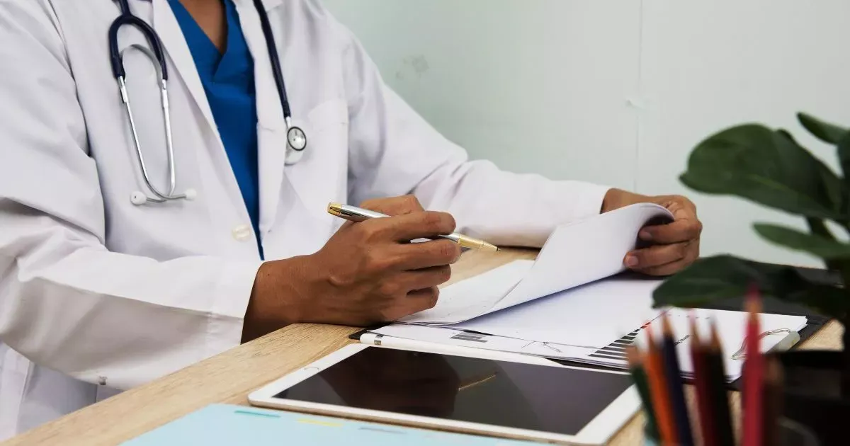 Grayscale image of a robotic arm in a clean, modern environment.