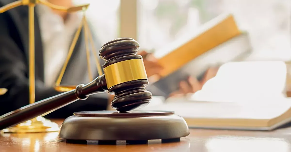 Grayscale image of a robotic arm in a clean, modern environment.