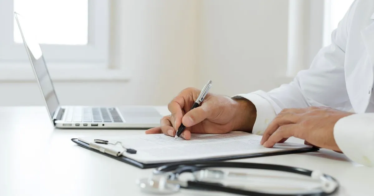 Grayscale image of a robotic arm in a clean, modern environment.