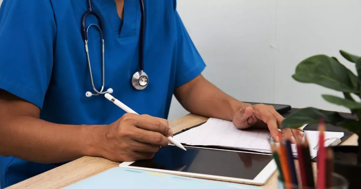 Grayscale image of a robotic arm in a clean, modern environment.