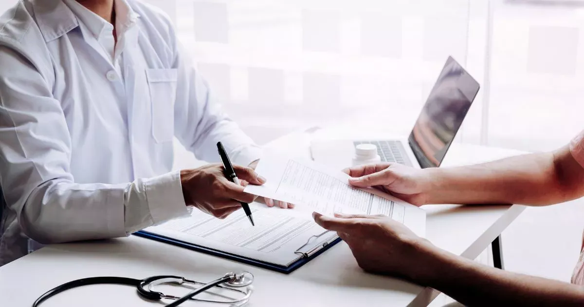 Grayscale image of a robotic arm in a clean, modern environment.