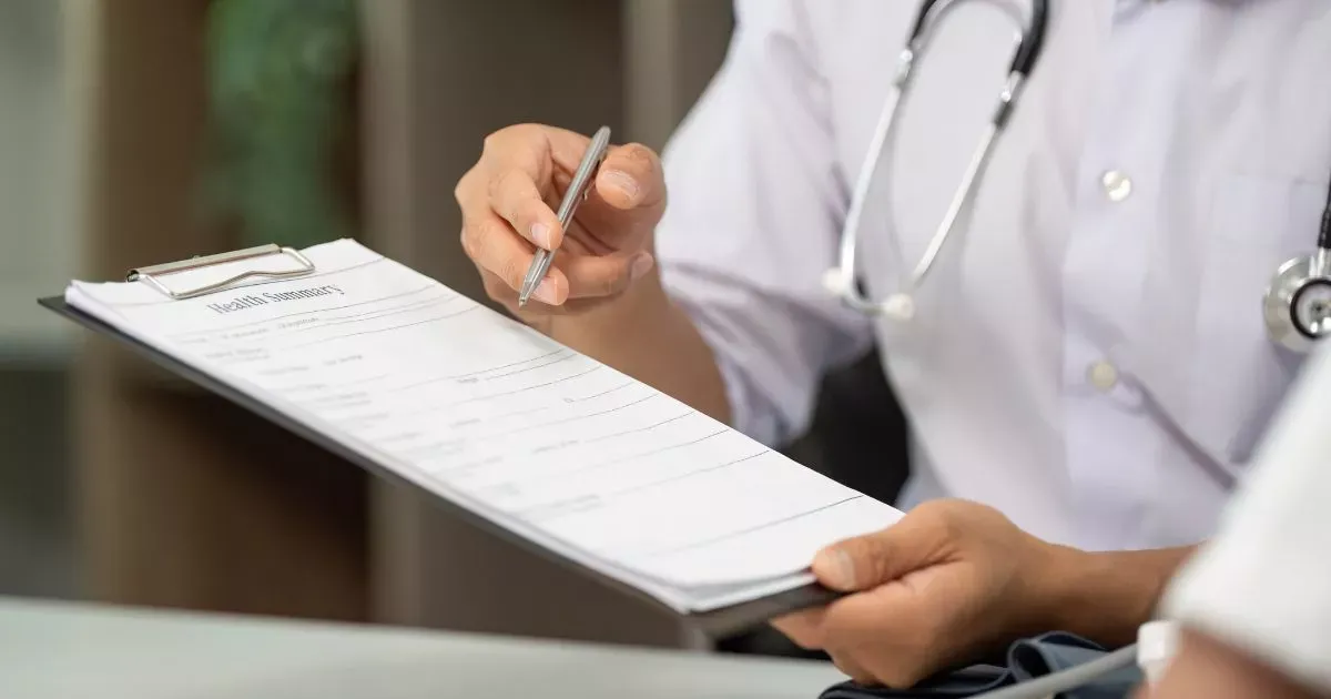 Grayscale image of a robotic arm in a clean, modern environment.