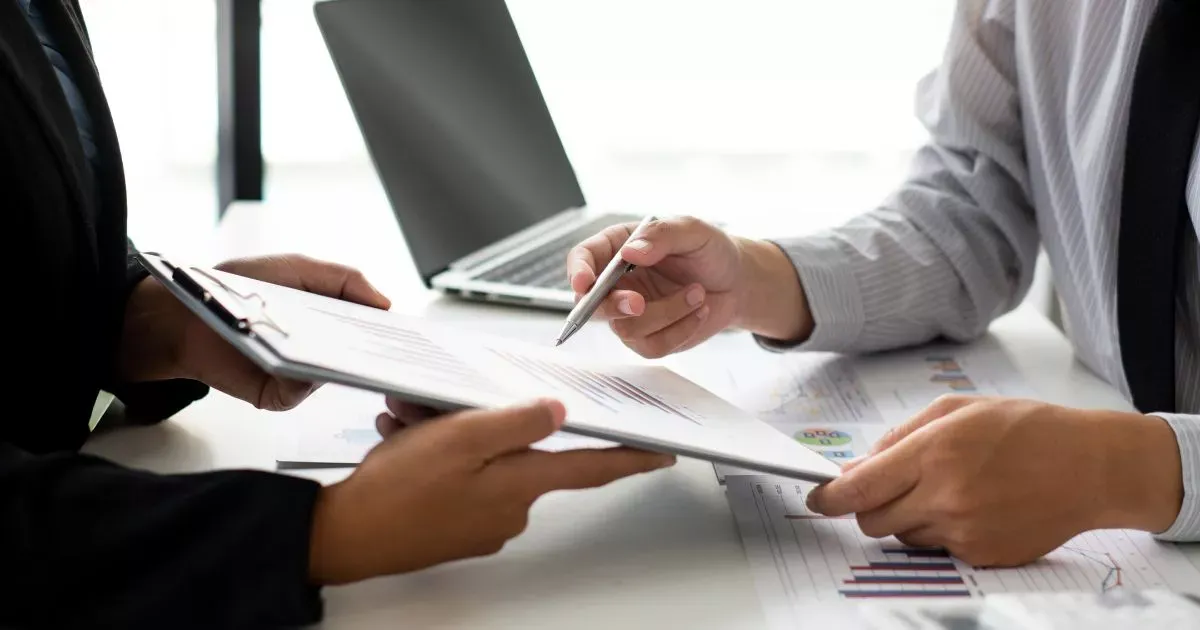 Grayscale image of a robotic arm in a clean, modern environment.