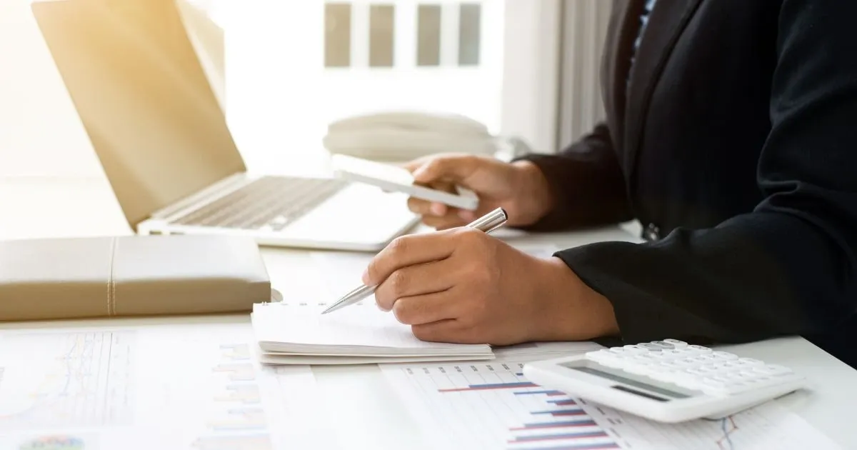 Grayscale image of a robotic arm in a clean, modern environment.