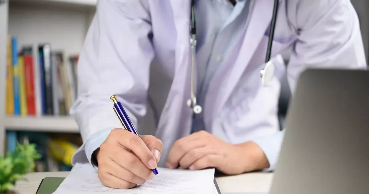 Grayscale image of a robotic arm in a clean, modern environment.