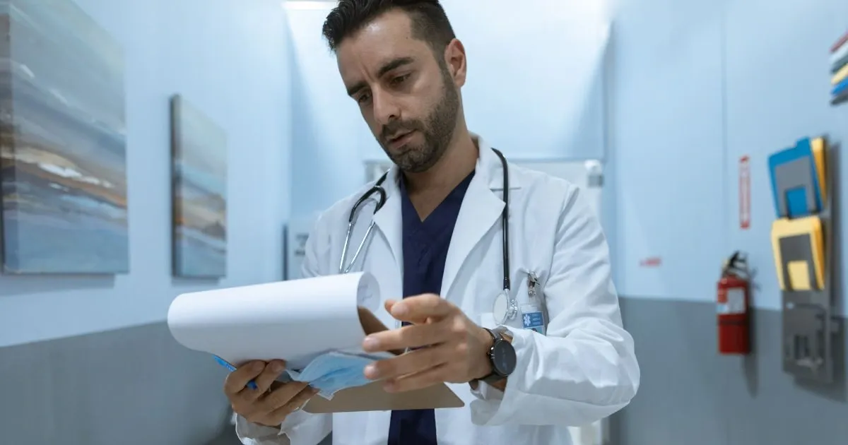 Grayscale image of a robotic arm in a clean, modern environment.