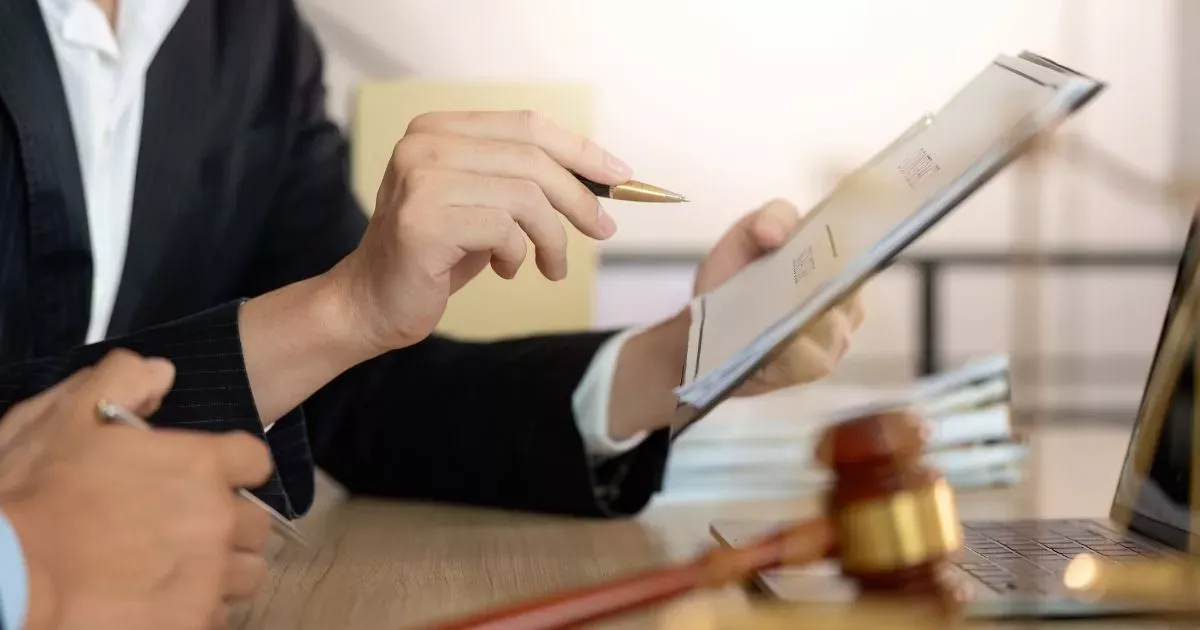 Grayscale image of a robotic arm in a clean, modern environment.