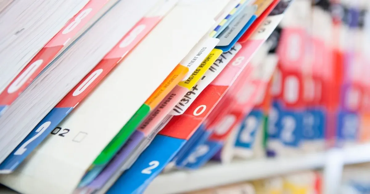 Grayscale image of a robotic arm in a clean, modern environment.