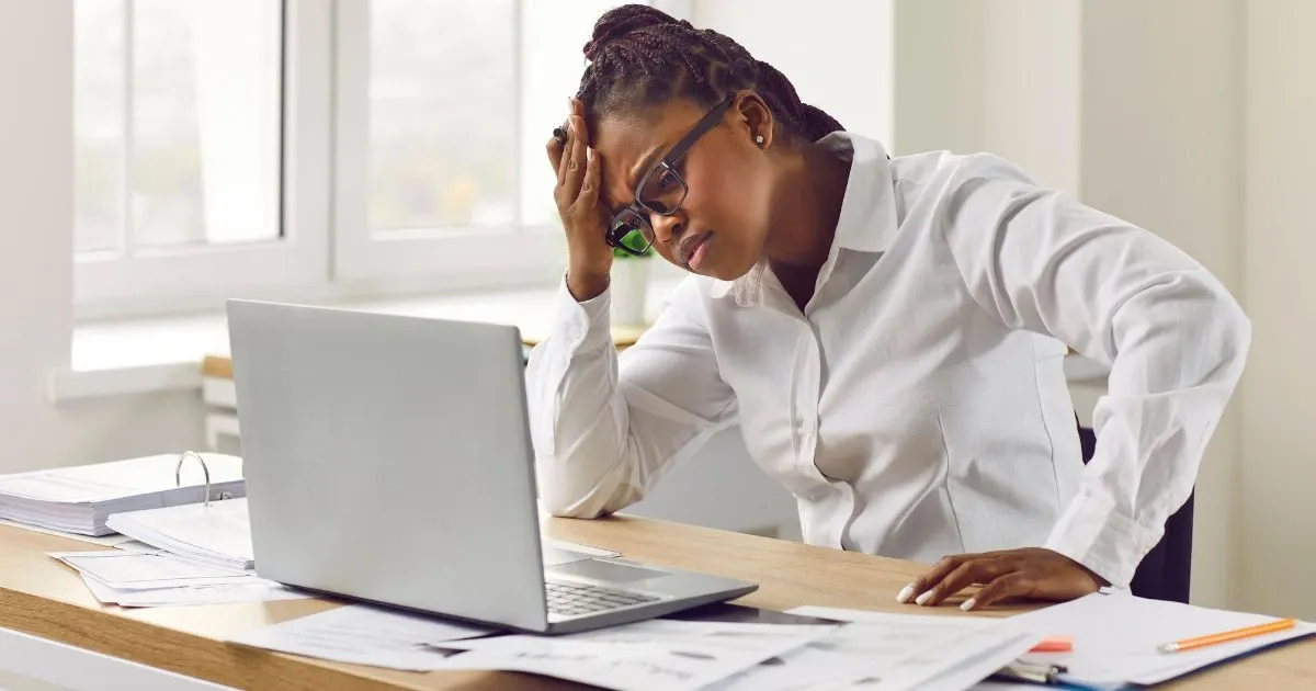 Grayscale image of a robotic arm in a clean, modern environment.