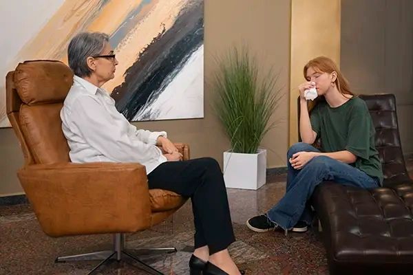 Authentic scene young person undergoing psychological therapy