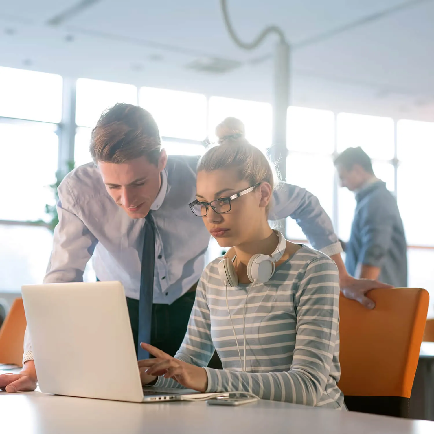 Team collaborating in a meeting to implement strategy