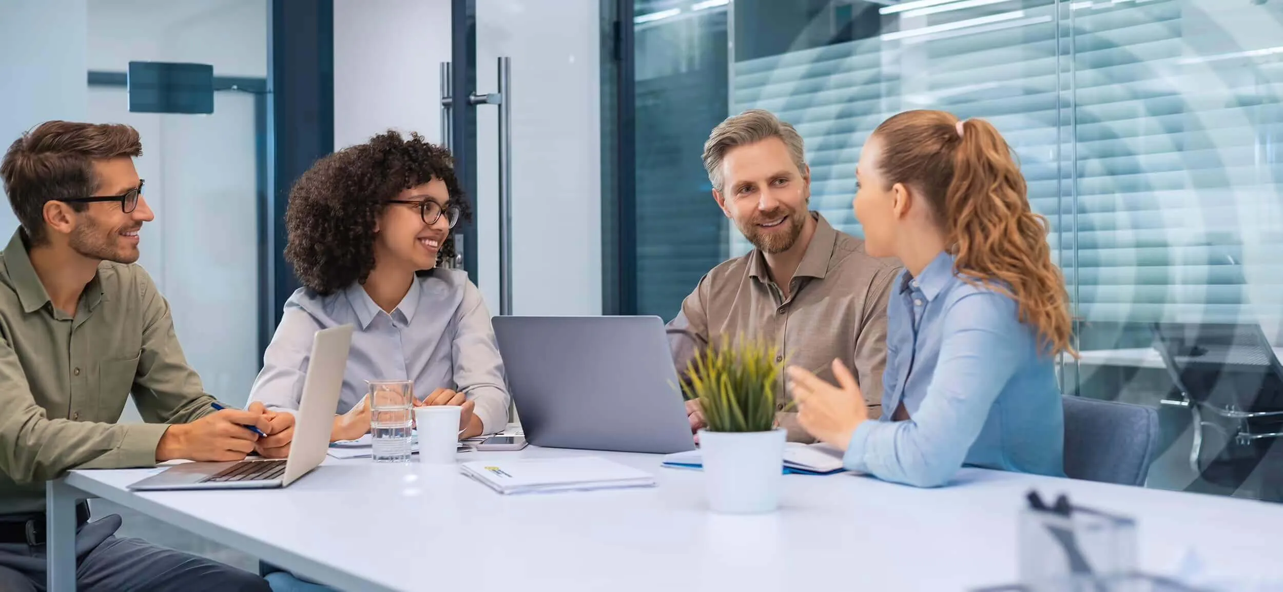 Diverse team collaborating on a business project with focus and clarity