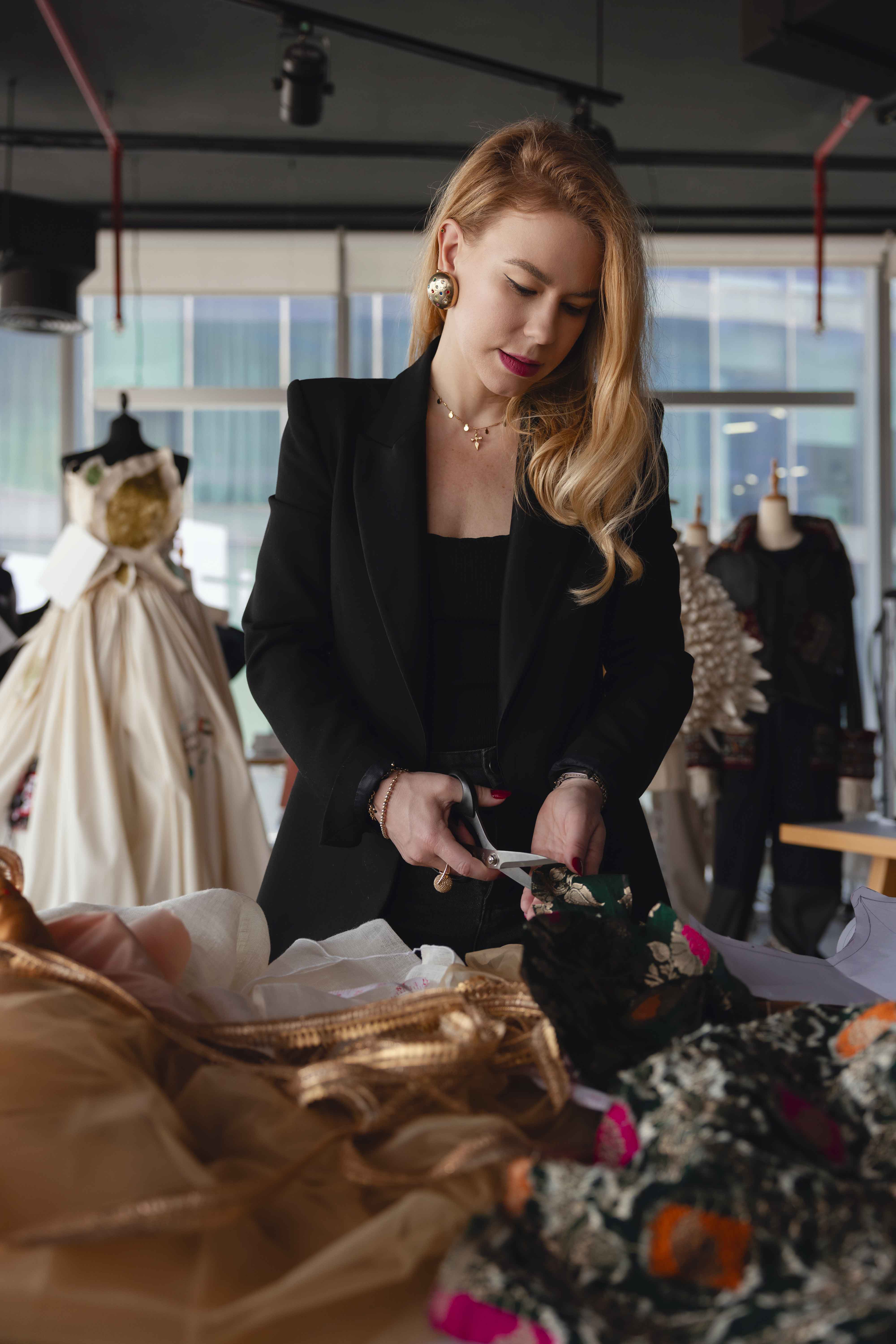 A DIDI female student engaged in fashion design activities