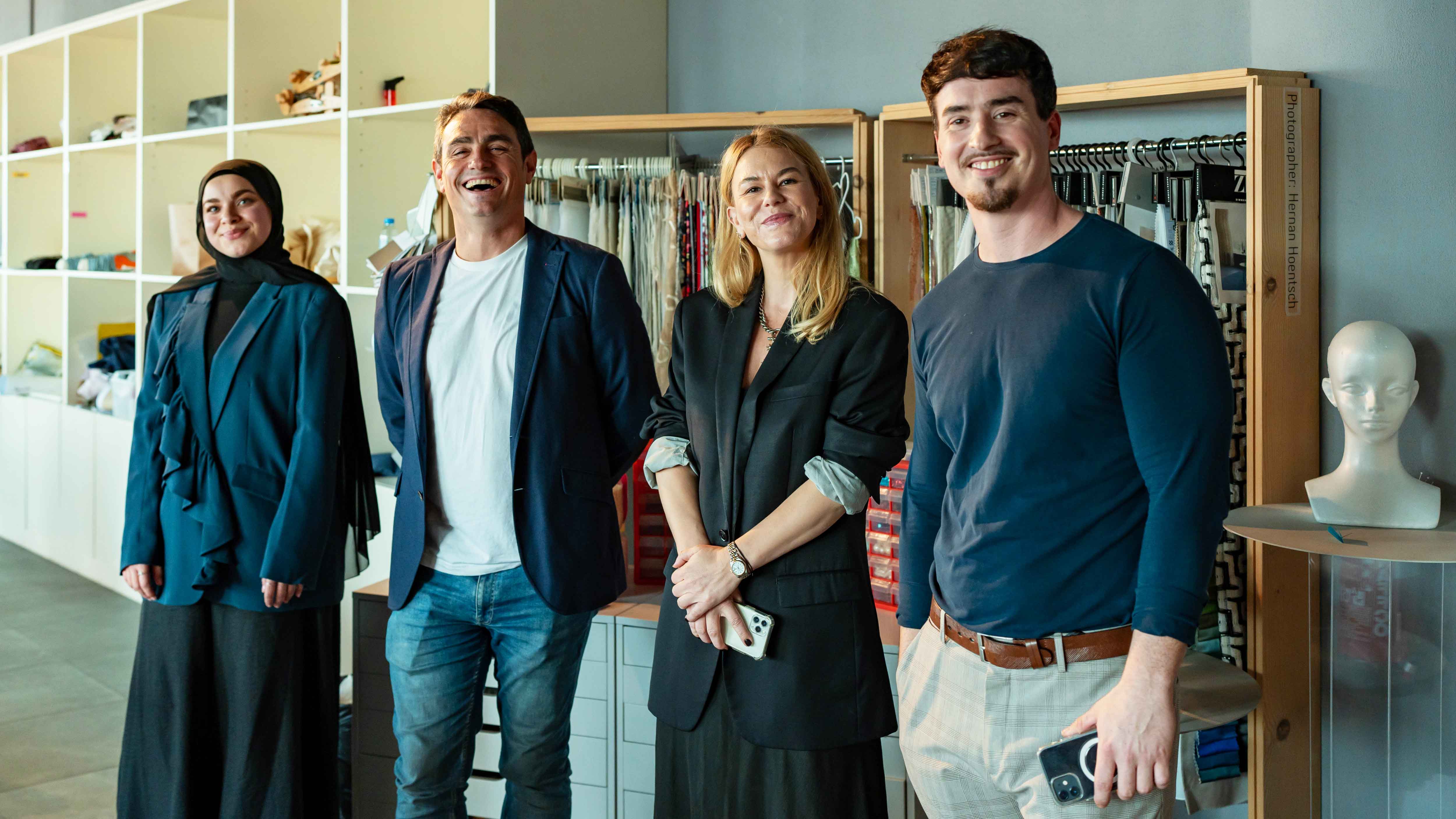 A team from DIDI, consisting of two women and two men, in a design lab.