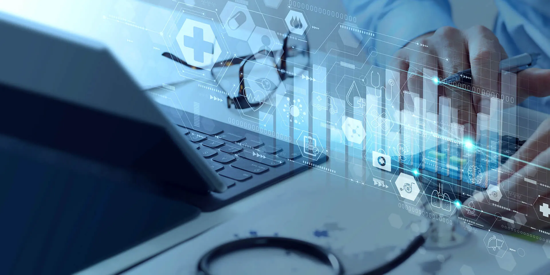 Laptop with data appearing on a futuristic, transparent screen