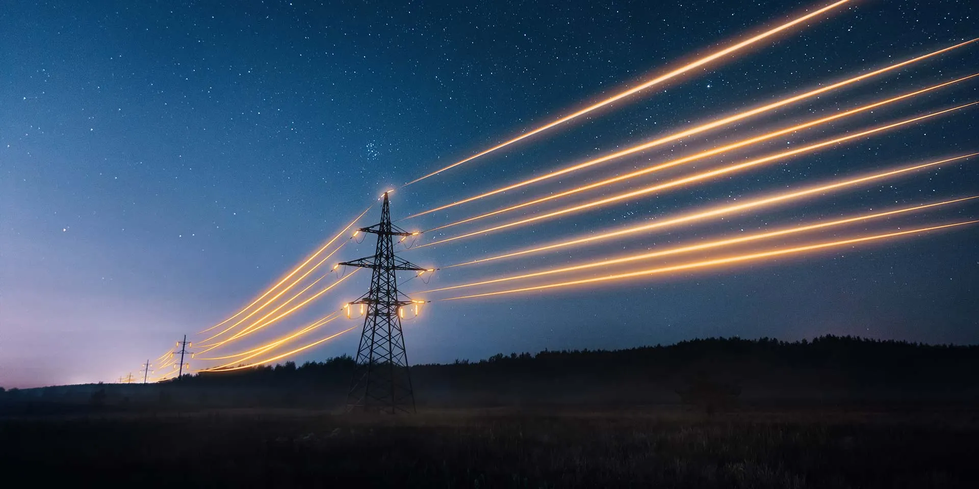 Night sky with illuminated power lines