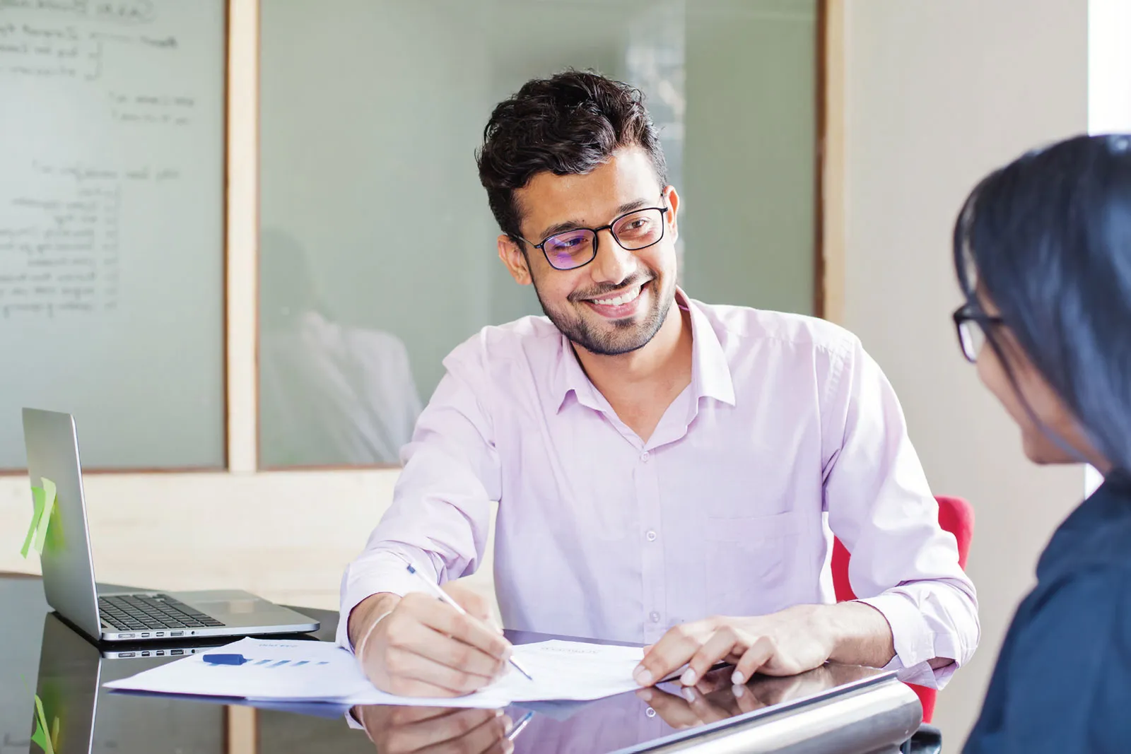 Two people meeting at desk