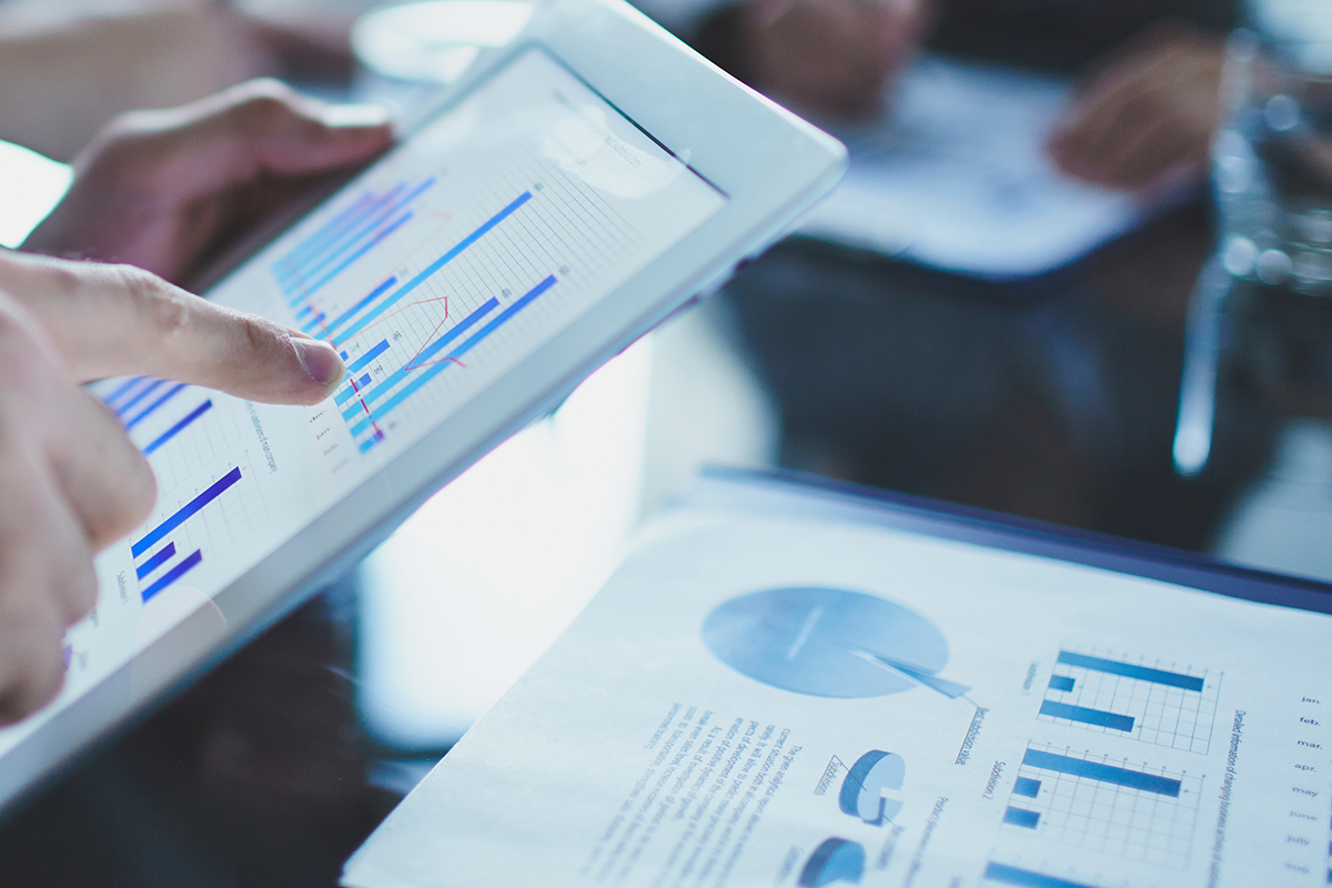 reviewing white paper data on a tablet
