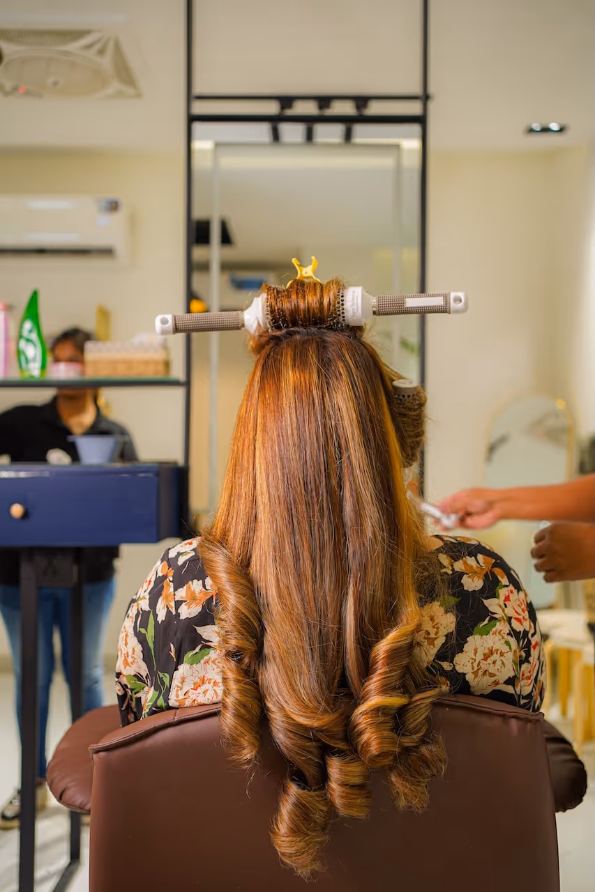 Woman showing her hair treatment at Juve Spa