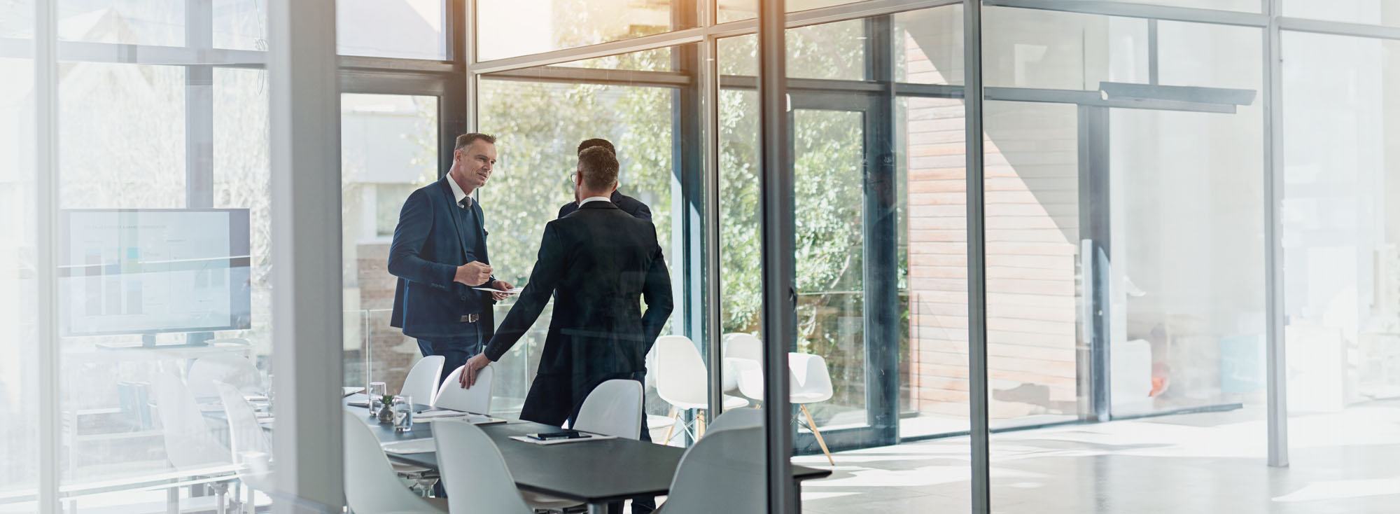 A couple of people that are standing in a room.