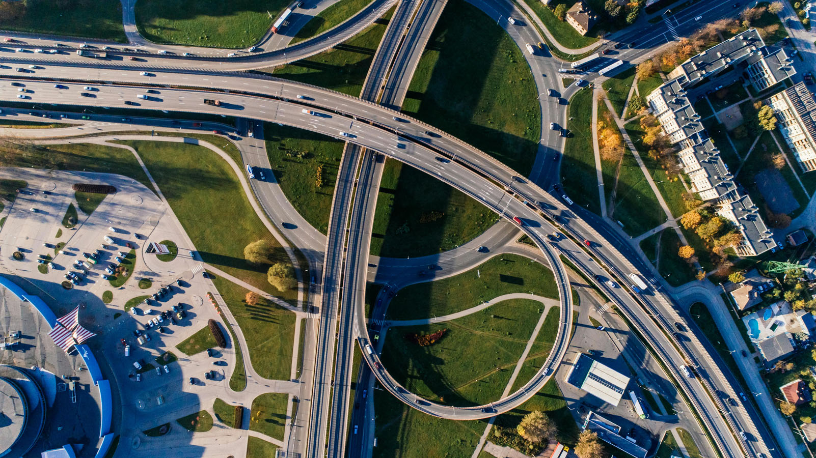 An aerial view of a highway intersection in a city.