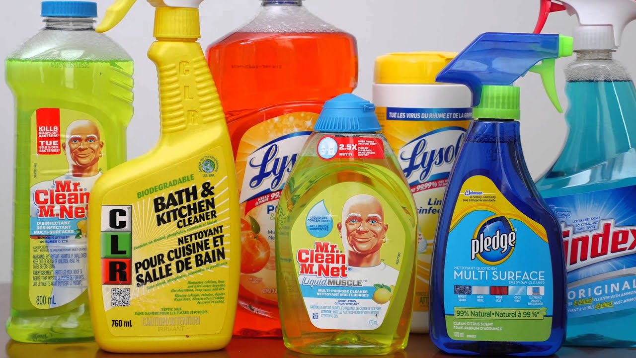 Various household cleaning products including Mr. Clean, CLR Bath & Kitchen Cleaner, Lysol, Pledge Multi Surface, and Windex arranged in a group.